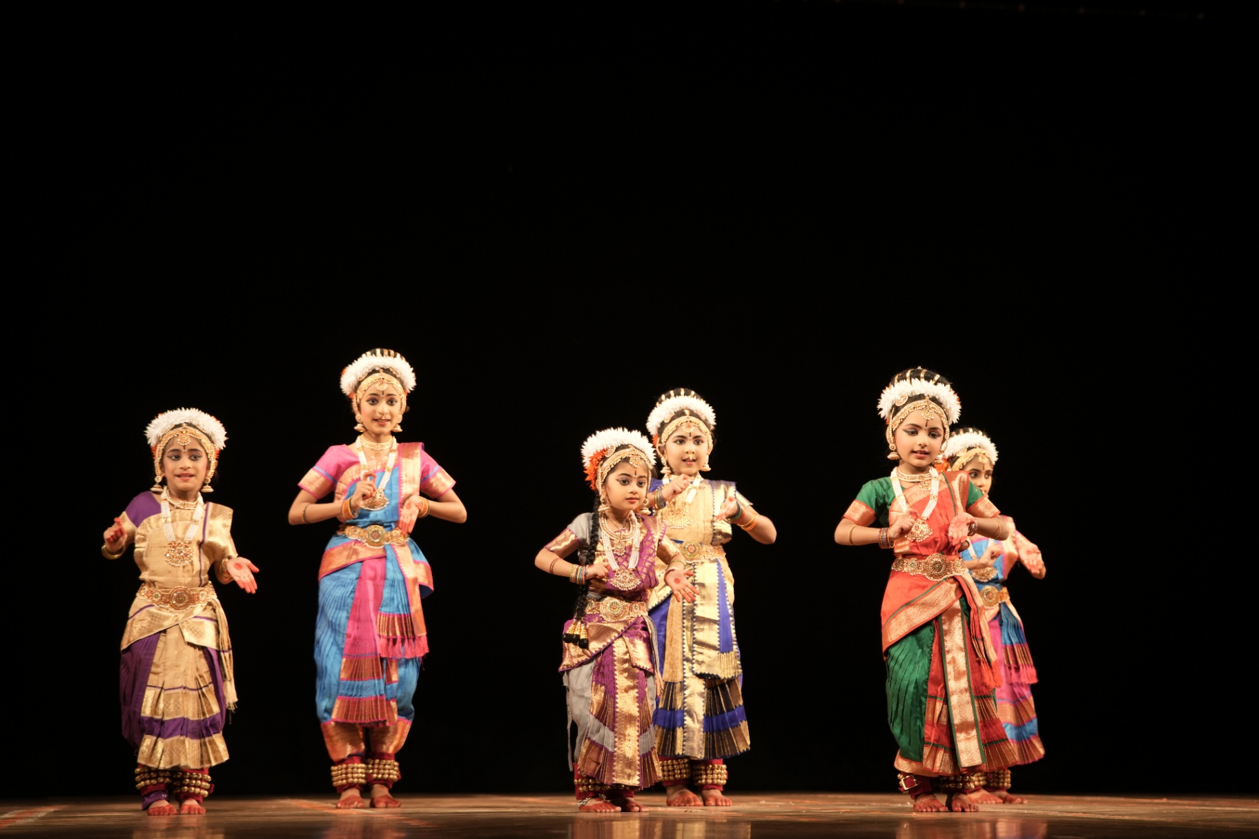 Junior students performing together on stage